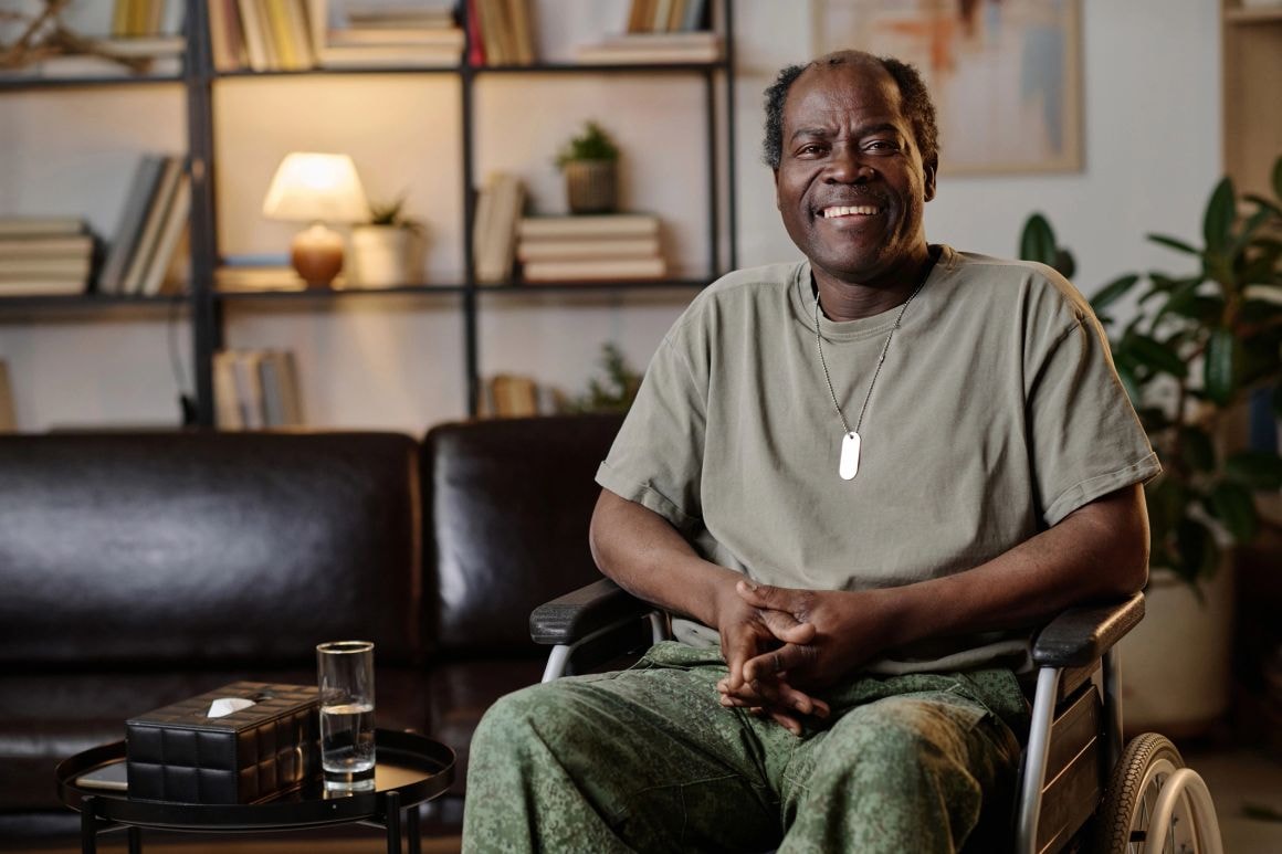 Happy veteran man smiling in his living room
